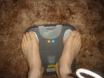 Trent's feet while weighing himself on a scale