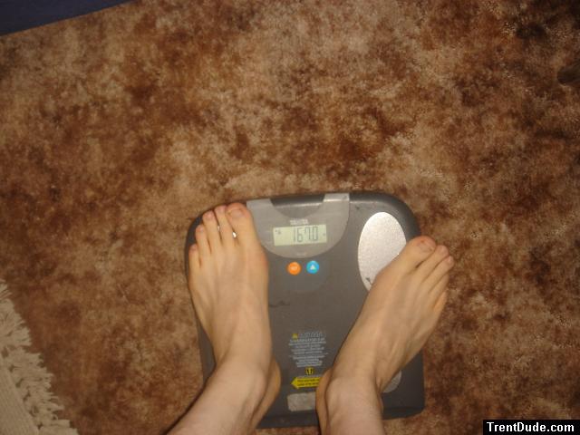 Trent's feet while weighing himself on a scale