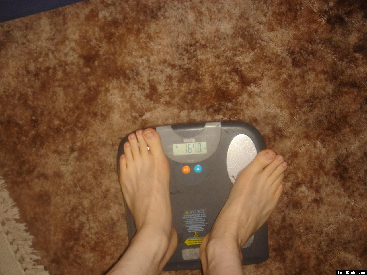 Trent's feet while weighing himself on a scale
