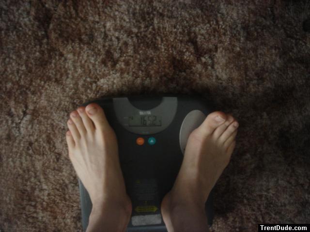 Trent's feet while weighing himself on a scale
