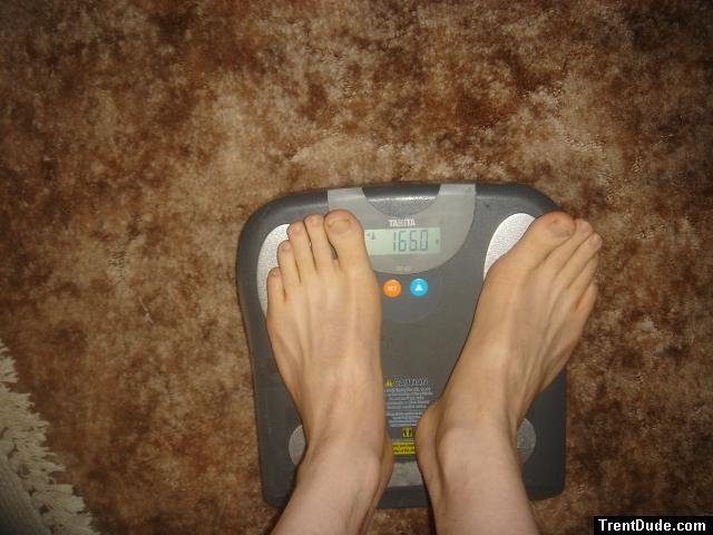 Trent's feet while weighing himself on a scale