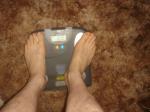 Trent's feet while weighing himself on a scale