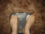 Trent's feet while weighing himself on a scale