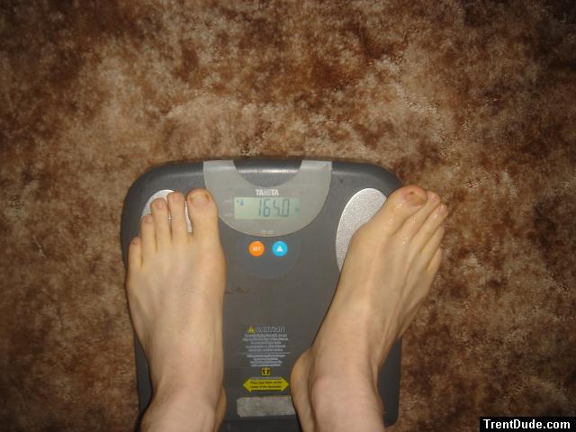 Trent's feet while weighing himself on a scale