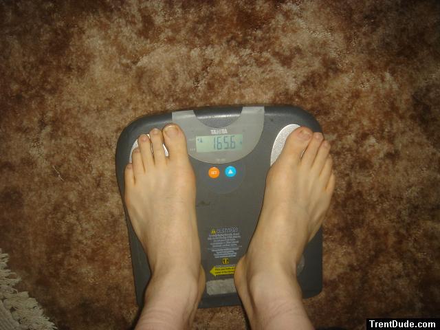 Trent's feet while weighing himself on a scale