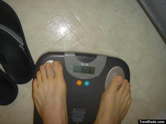 Trent's feet while weighing himself on a scale