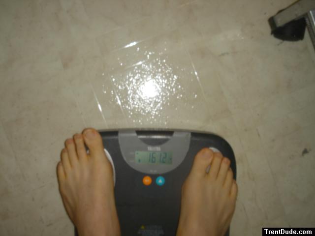 Trent's feet while weighing himself on a scale
