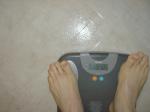 Trent's feet while weighing himself on a scale