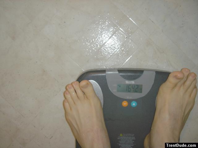 Trent's feet while weighing himself on a scale
