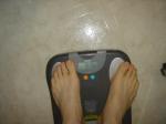 Trent's feet while weighing himself on a scale