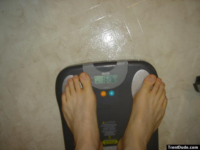Trent's feet while weighing himself on a scale