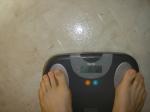 Trent's feet while weighing himself on a scale