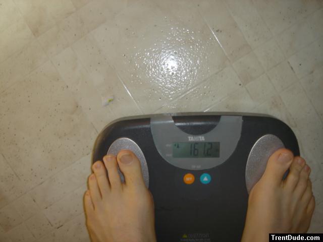 Trent's feet while weighing himself on a scale