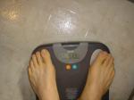 Trent's feet while weighing himself on a scale