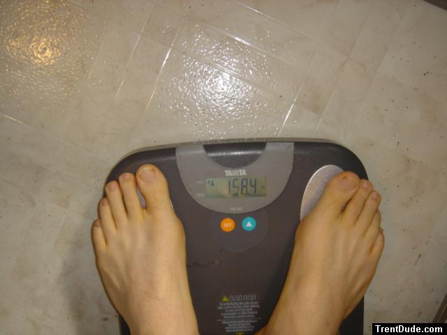 Trent's feet while weighing himself on a scale