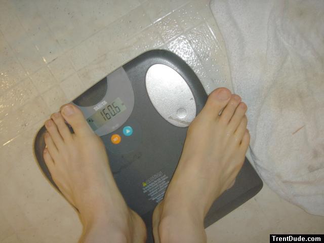 Trent's feet while weighing himself on a scale