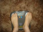 Trent's feet while weighing himself on a scale