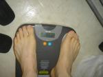 Trent's feet while weighing himself on a scale