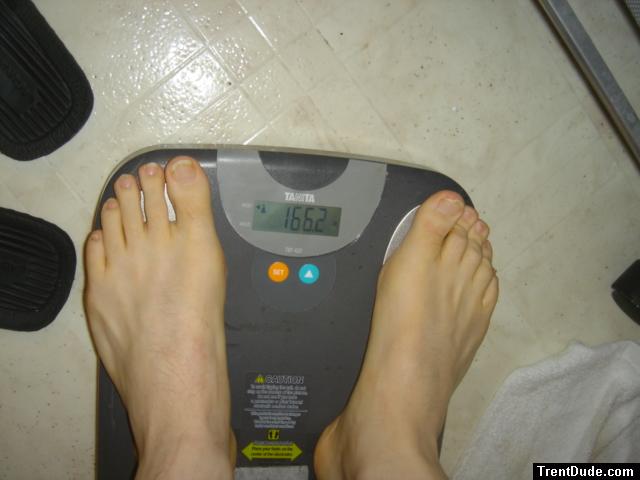 Trent's feet while weighing himself on a scale