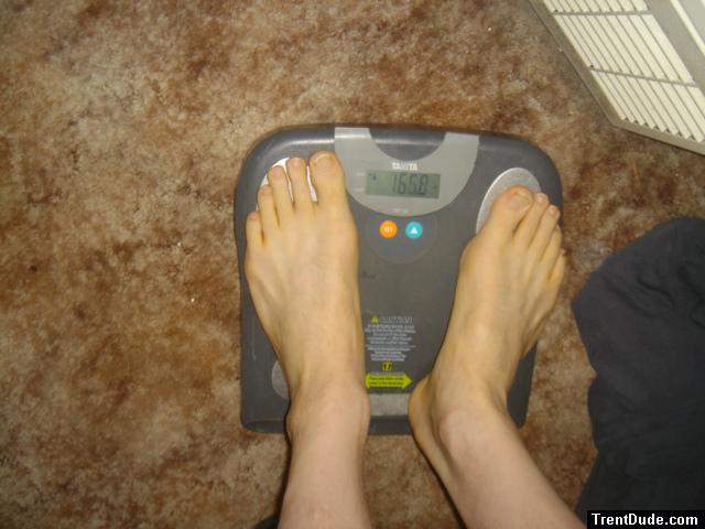 Trent's feet while weighing himself on a scale