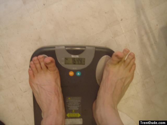 Trent's feet while weighing himself on a scale