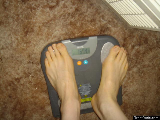 Trent's feet while weighing himself on a scale