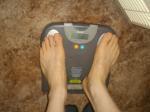 Trent's feet while weighing himself on a scale