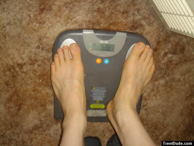 Trent's feet while weighing himself on a scale
