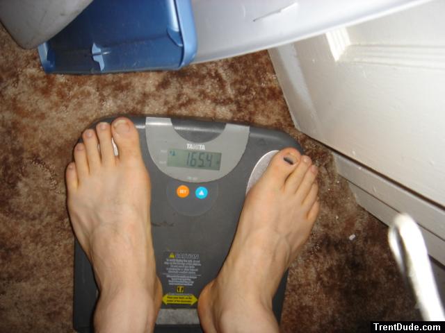 Trent's feet while weighing himself on a scale
