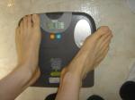 Trent's feet while weighing himself on a scale