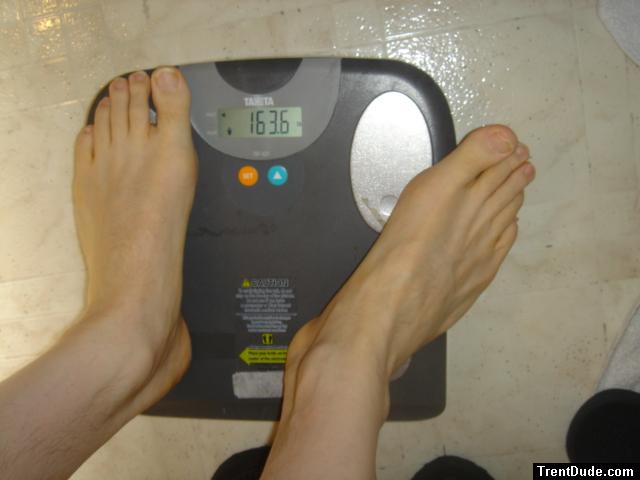 Trent's feet while weighing himself on a scale