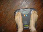 Trent's feet while weighing himself on a scale