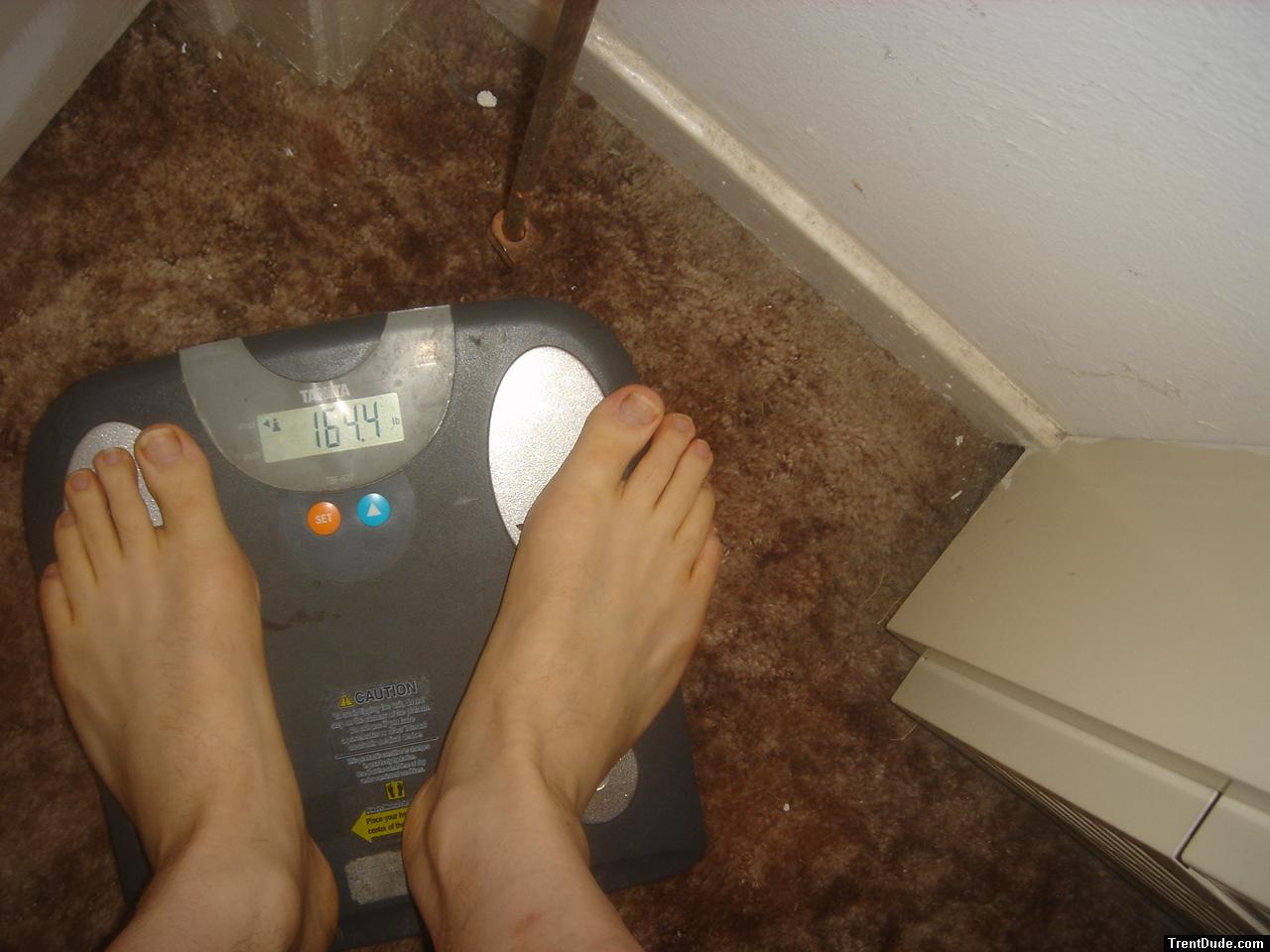 Trent's feet while weighing himself on a scale