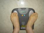 Trent's feet while weighing himself on a scale