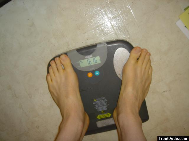 Trent's feet while weighing himself on a scale