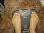 Trent's feet while weighing himself on a scale