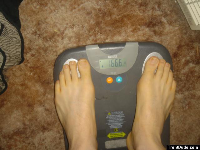 Trent's feet while weighing himself on a scale