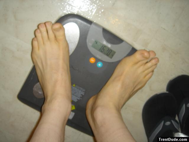 Trent's feet while weighing himself on a scale