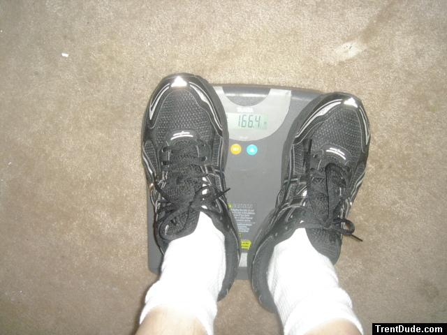 Trent's feet while weighing himself on a scale