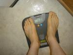 Trent's feet while weighing himself on a scale