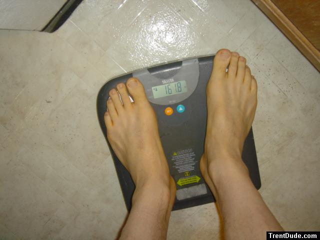 Trent's feet while weighing himself on a scale