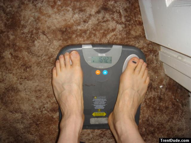 Trent's feet while weighing himself on a scale
