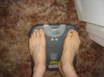 Trent's feet while weighing himself on a scale