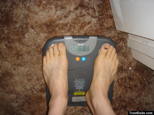 Trent's feet while weighing himself on a scale
