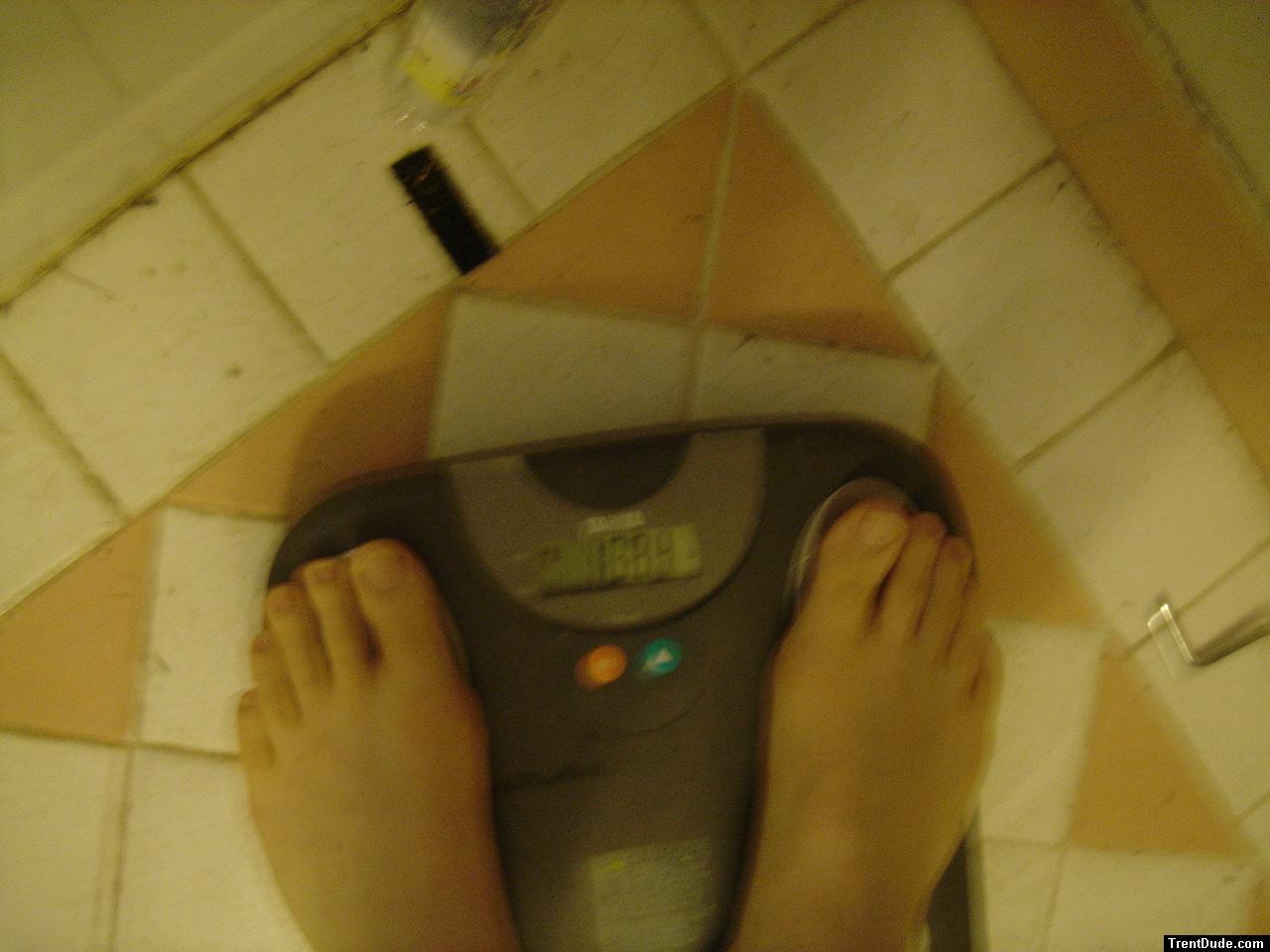 Trent's feet while weighing himself on a scale