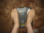 Trent's feet while weighing himself on a scale