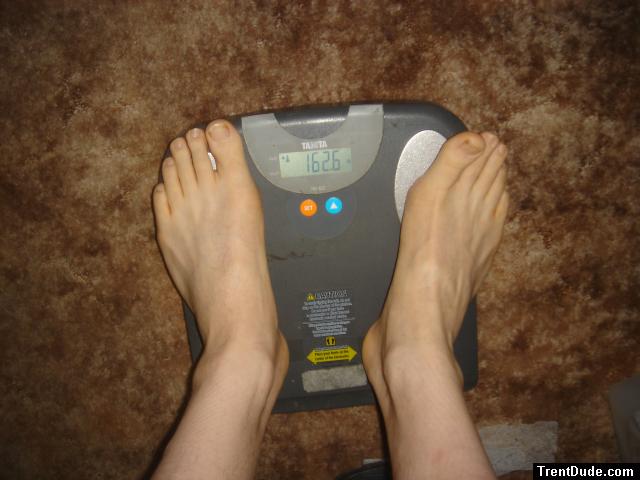 Trent's feet while weighing himself on a scale