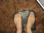 Trent's feet while weighing himself on a scale