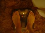 Trent's feet while weighing himself on a scale