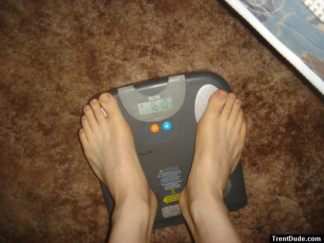 Trent's feet while weighing himself on a scale